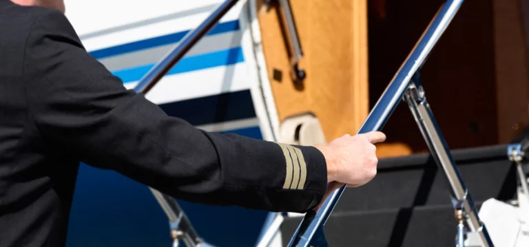 A pilot stepping into a business jet before flight.