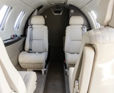 The rear view of the Cessna Citation M2 Gen2’s cabin showcases its spacious, luxurious seating and refined interior details. The sleek design and premium materials create a comfortable, elegant environment for private jet travelers.