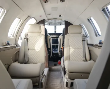 The interior cabin of the Cessna Citation M2 Gen2 features plush leather seating and a sleek, modern design, offering passengers a luxurious and comfortable flight experience. The spacious layout and refined details highlight the elegance of private jet travel.